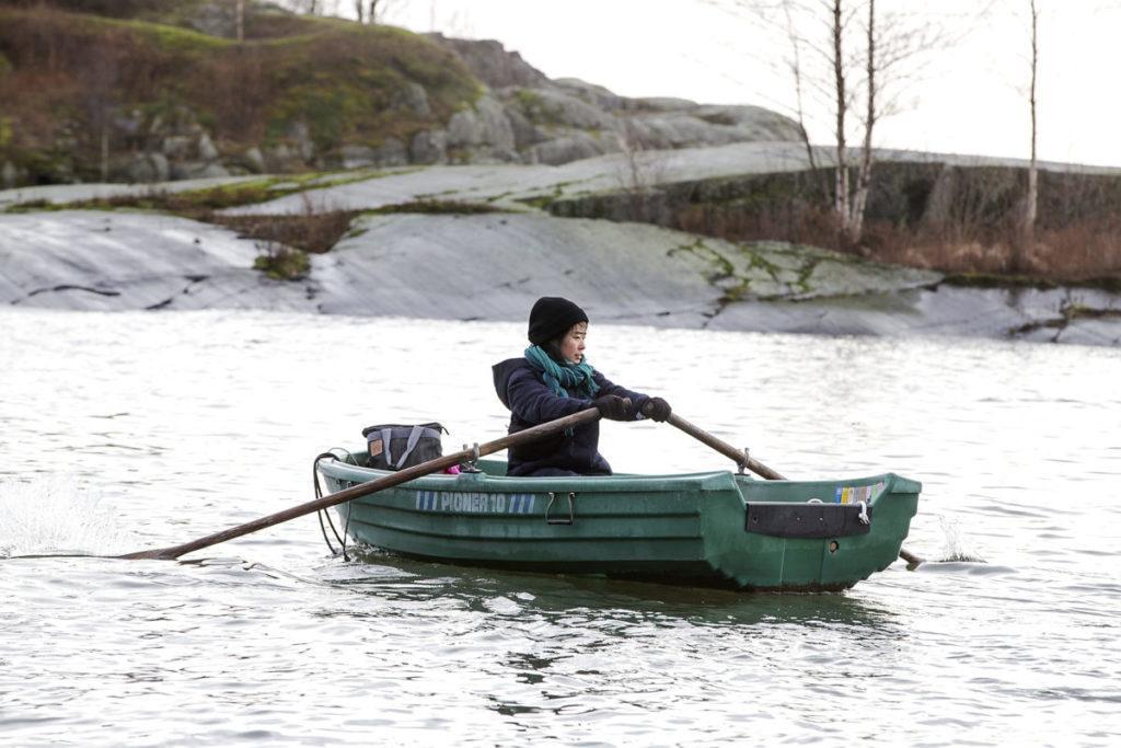 Aoi Yoshizawa rows to her workshop in Harakka island.